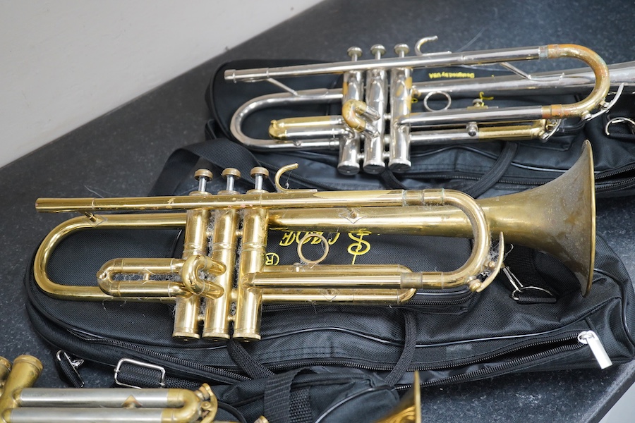 Three student trumpets by Beltone, etc. in soft cases and a cased Boosey & Hawkes trombone. Condition - poor to fair, all play